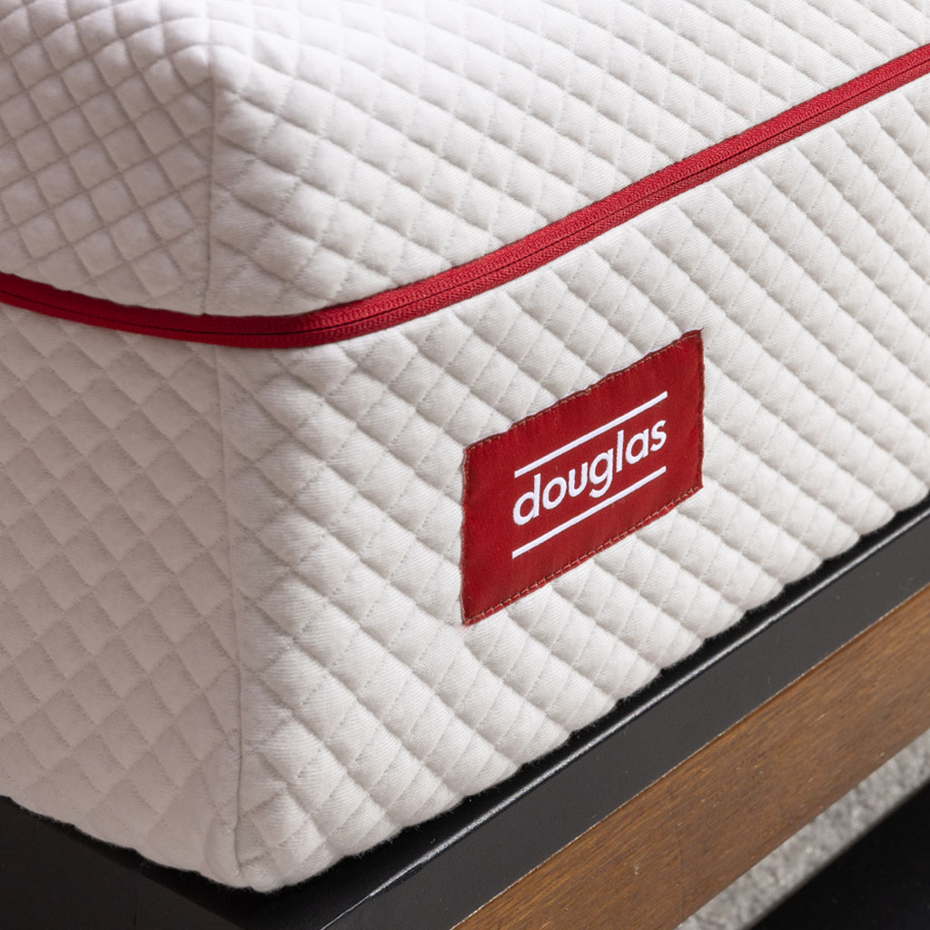 Closeup of the corner of a Douglas mattress showing cover texture