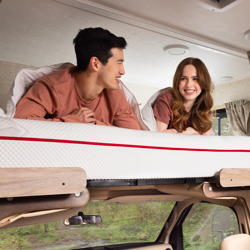 Couple on a Douglas mattress inside an RV