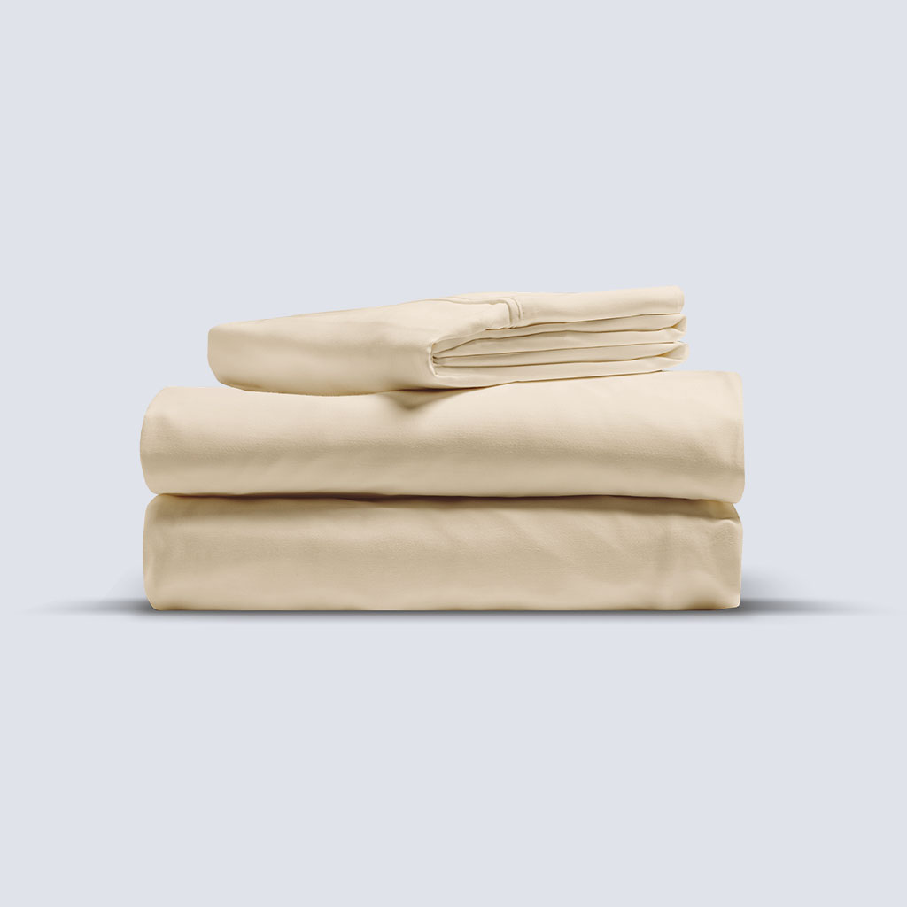 Folded oatmeal-coloured Egyptian cotton sheet set