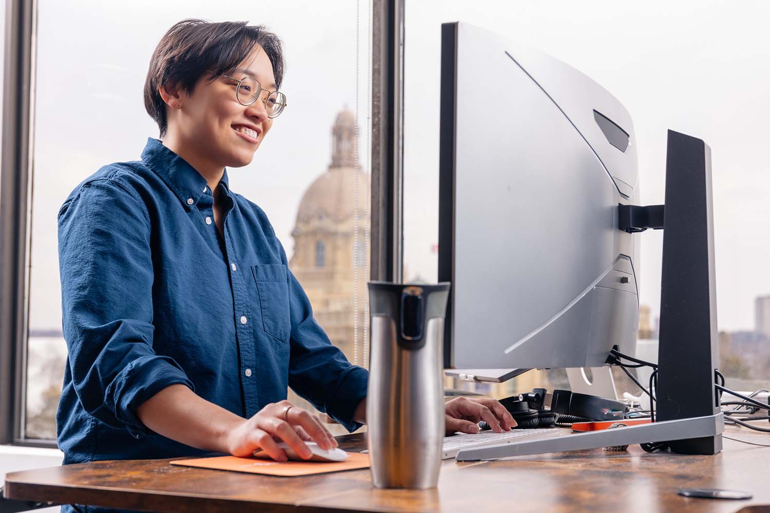<p>GoodMorning employee working at their desk</p>

