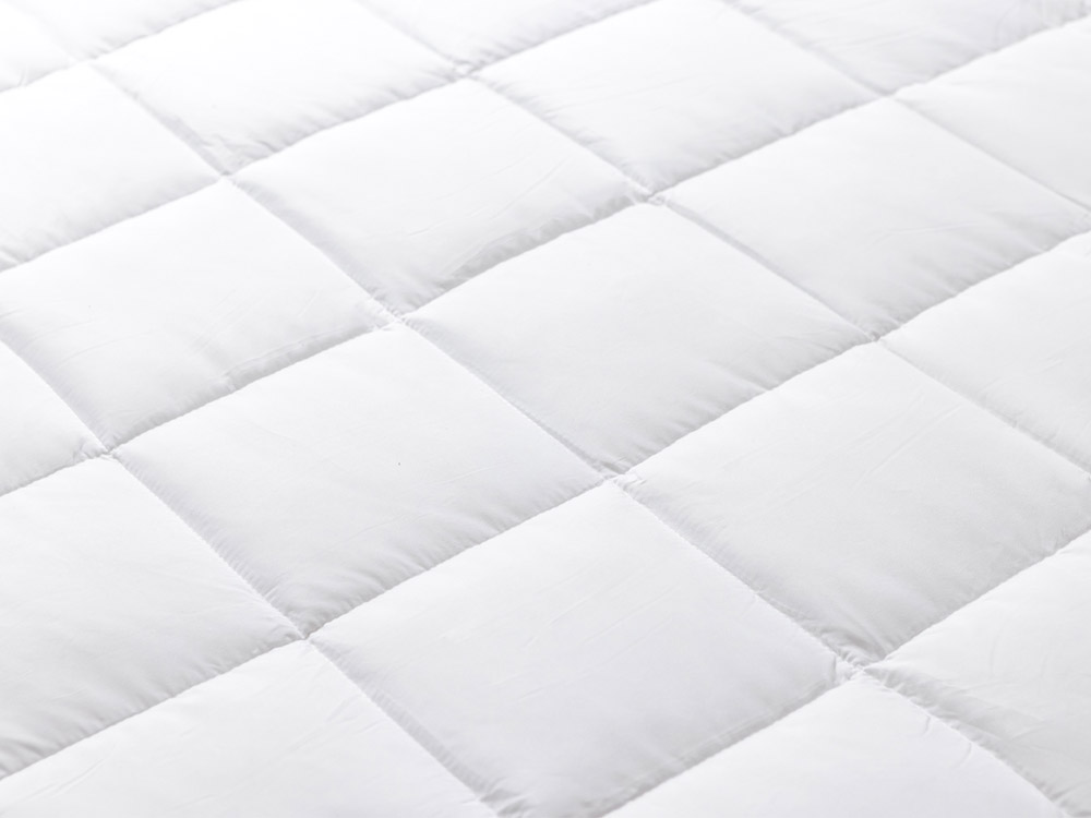 Closeup of quilted panels on down alternative duvet