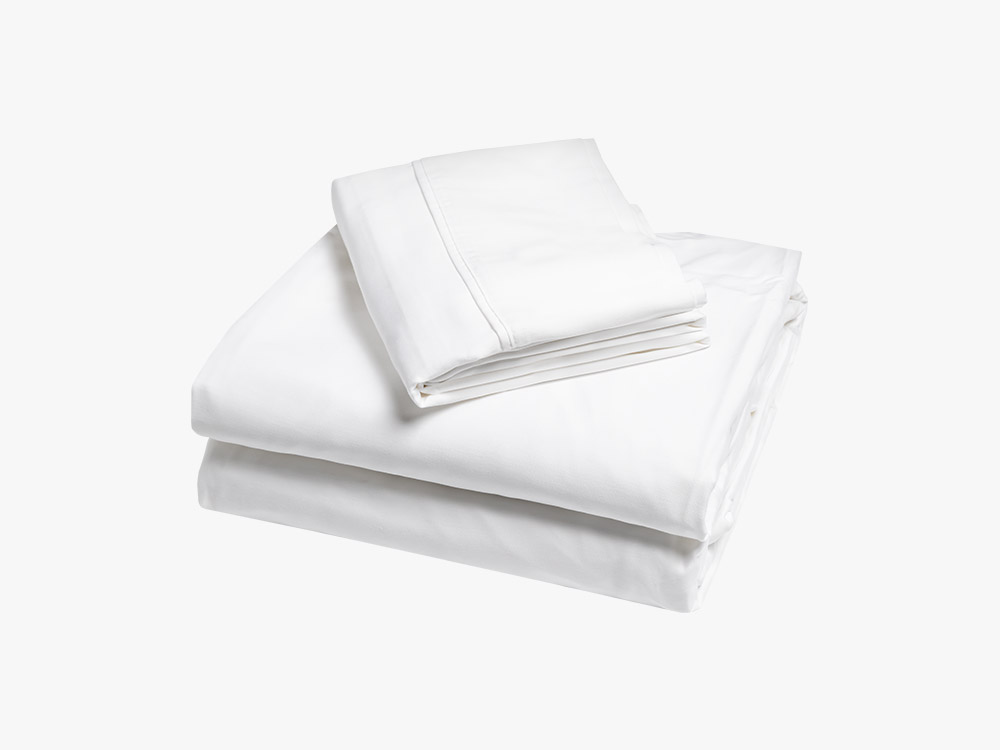 Sateen cotton sheets folded neatly, seen from above