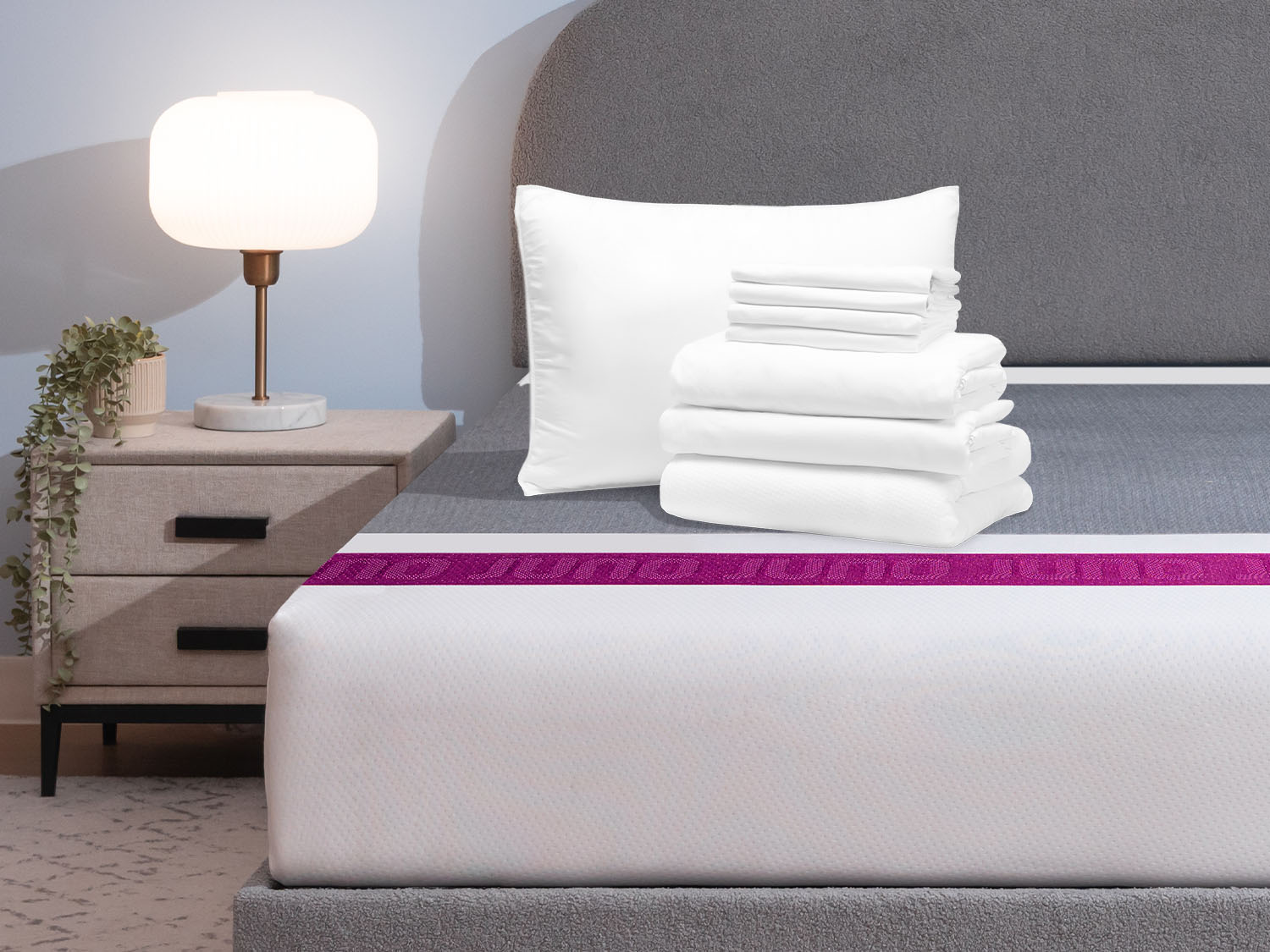 Comfort Sleep Bundle items on top of a Juno mattress