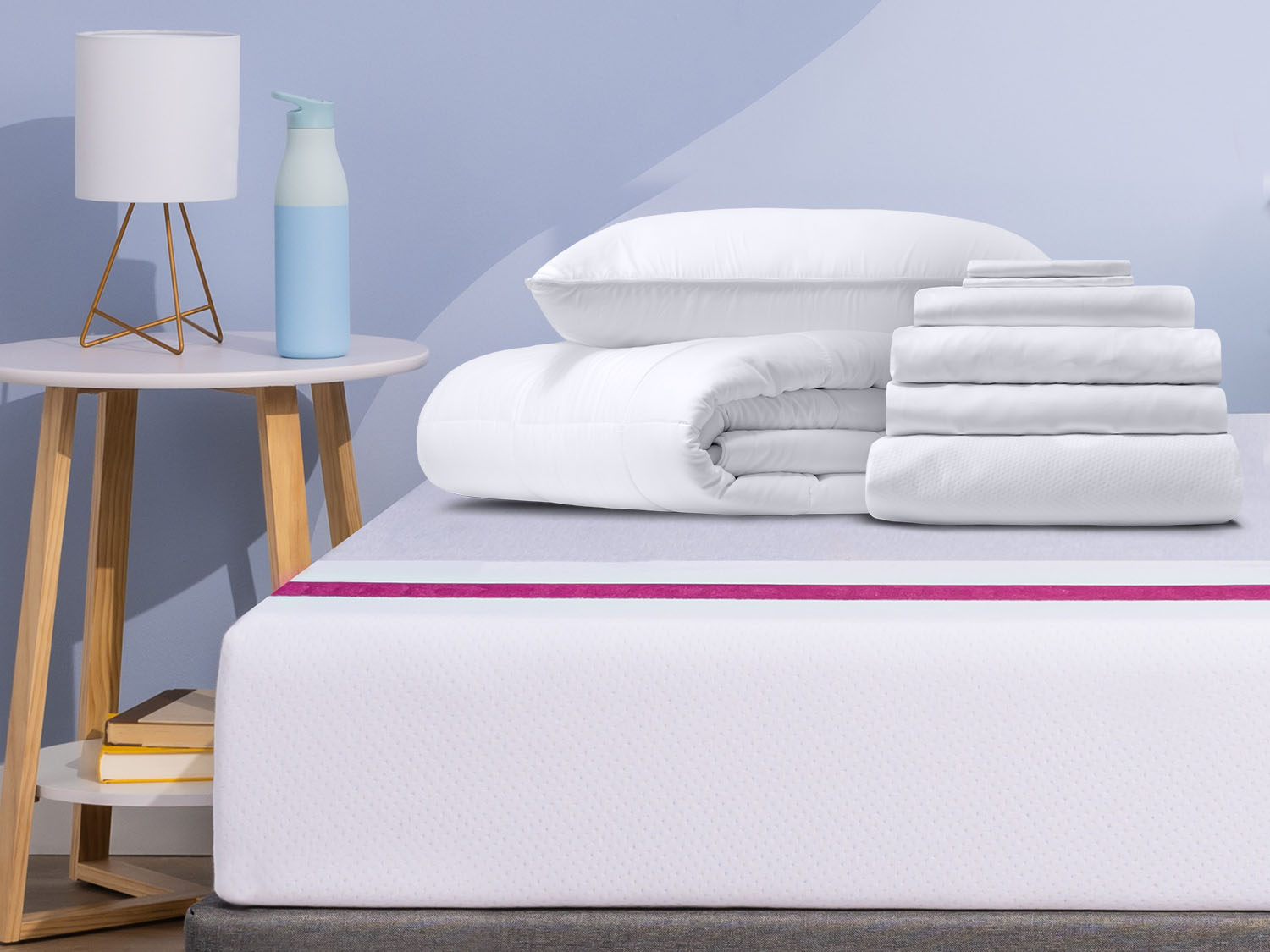 Comfort Sleep Bundle items on top of a Juno mattress