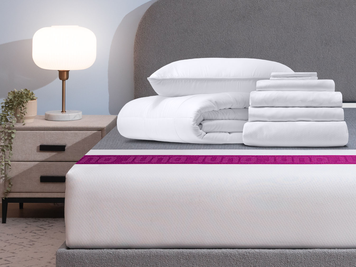 Comfort Sleep Bundle items on top of a Juno mattress