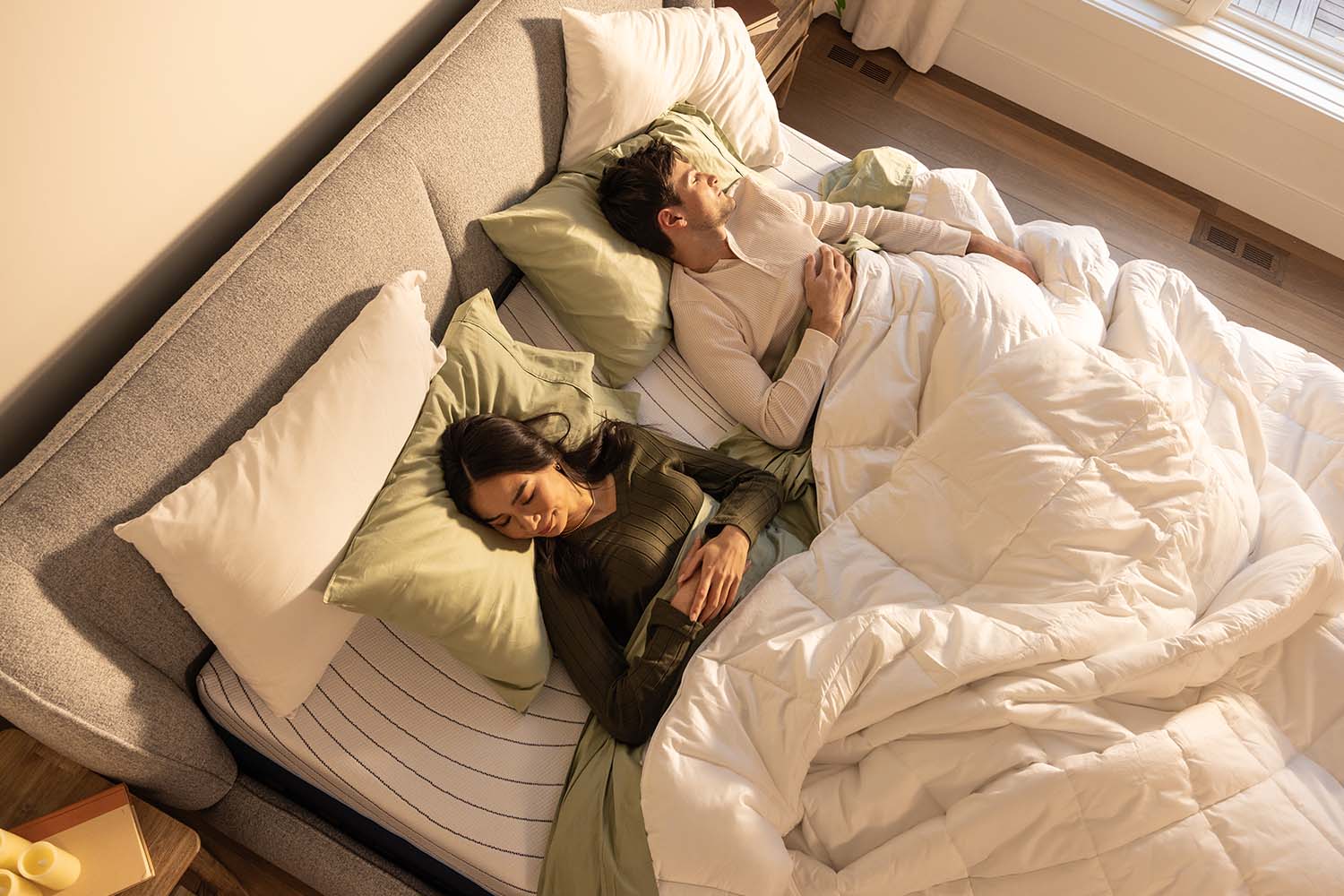 A couple peacefully sleeping on an Octave Horizon mattress.