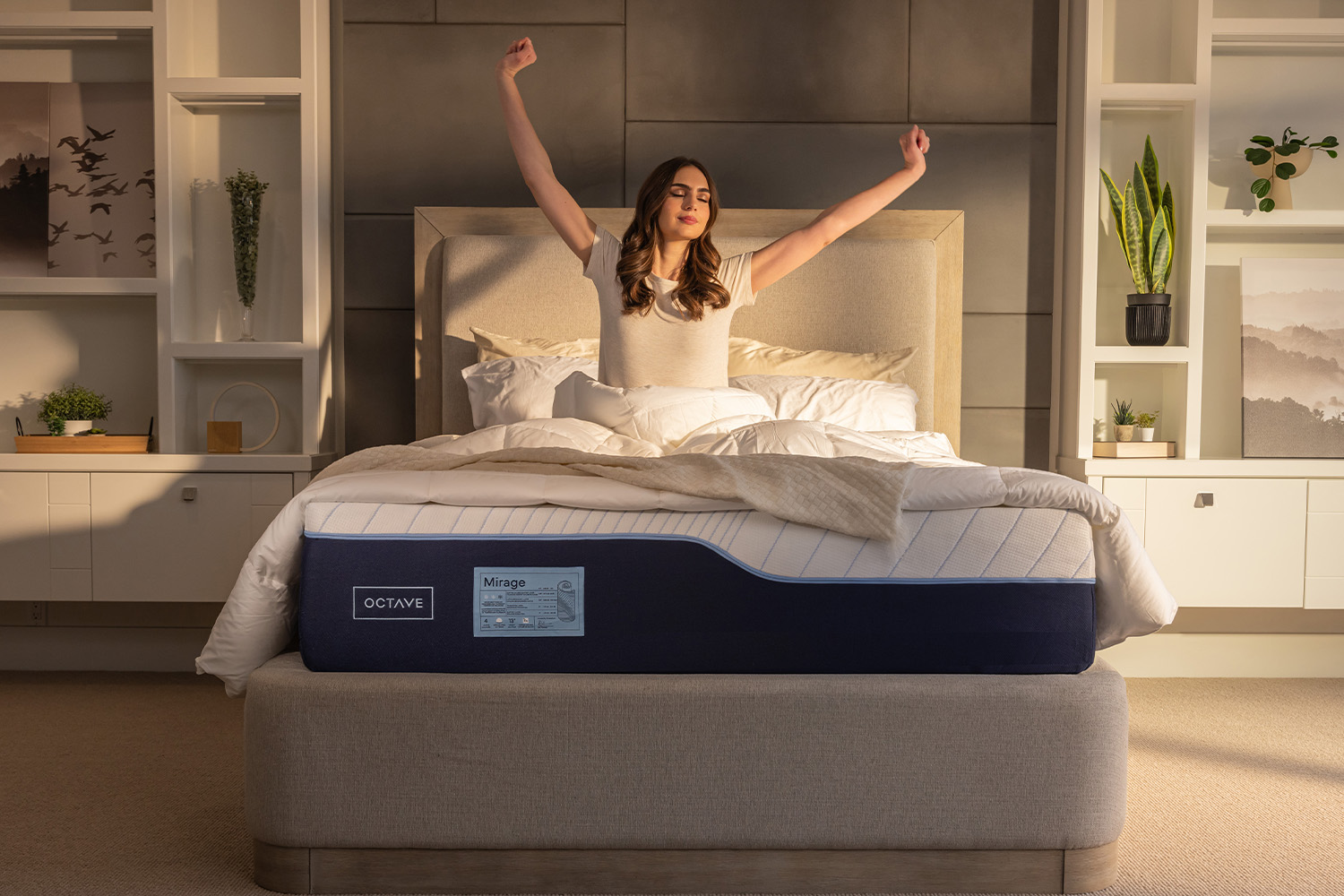 A woman stretching her back beside an Octave mattress.