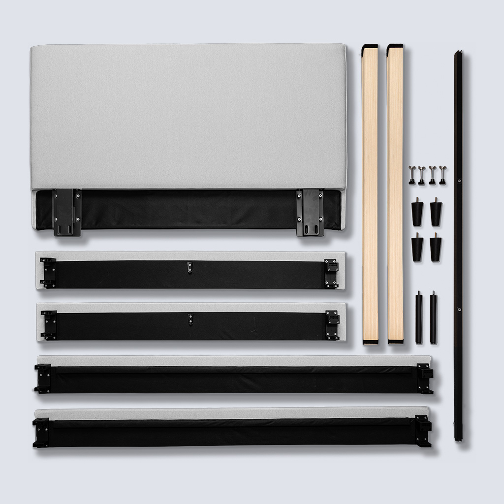 Unassembled parts of the upholstered bed frame