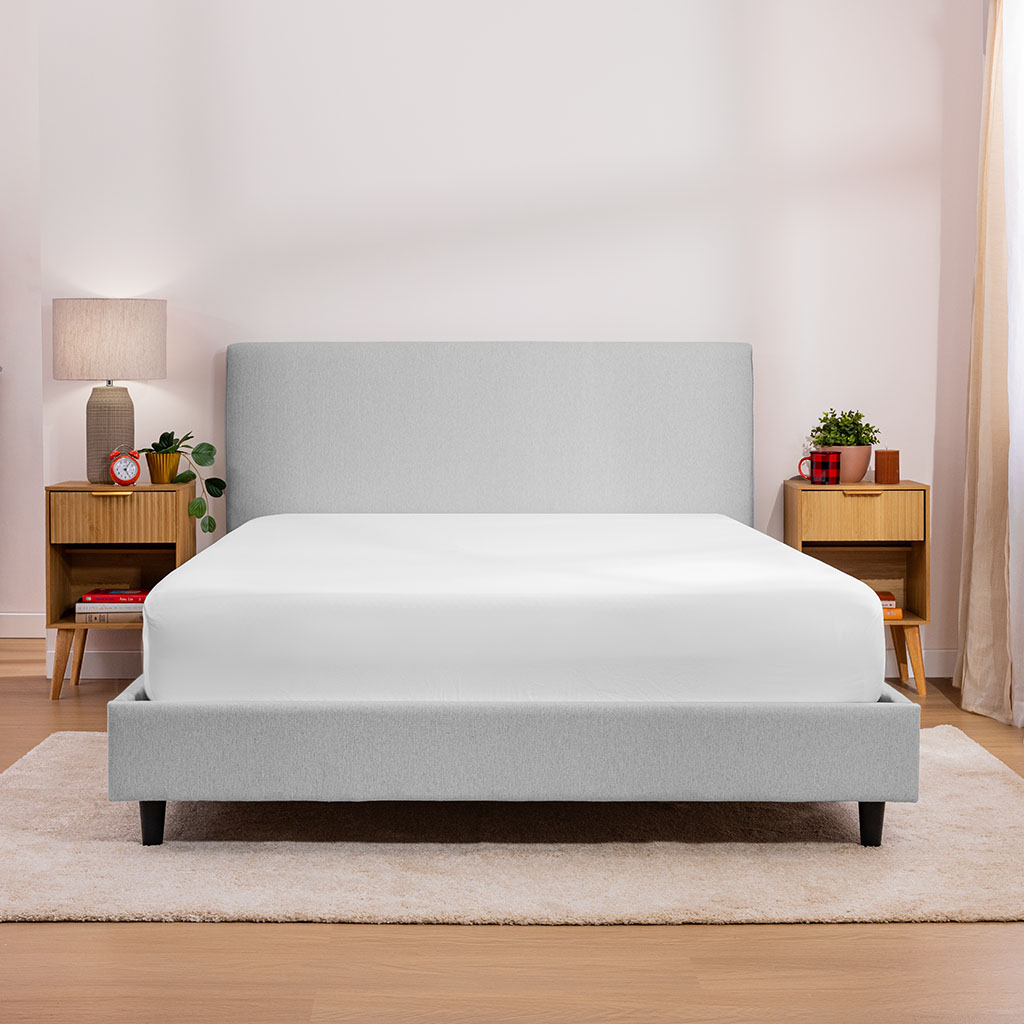 Grey upholstered bed frame with mattress