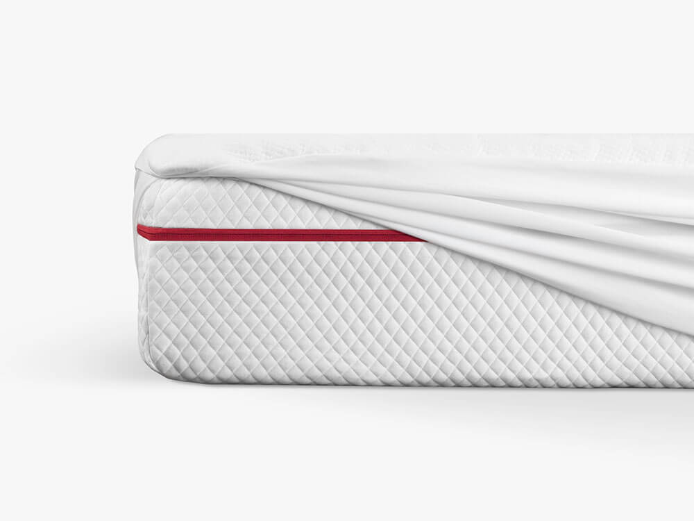 Mattress protector stretching over king-size Douglas.